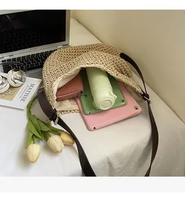 Large capacity woven straw tote bag showing internal space for tablet and essentials