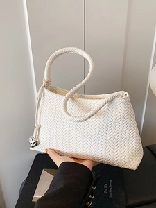 Elegant white woven handbag with silver heart charm for women summer fashion look
