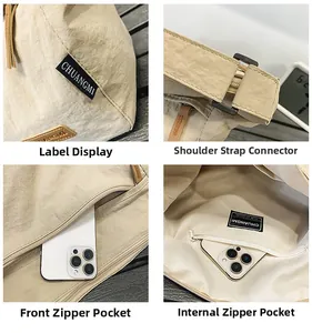Detail view of water-resistant beige nylon messenger bag with multiple zipper pockets