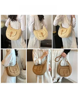 Detail view of crescent straw shoulder bag with leather flap pocket on female model
