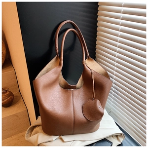 Detail of brown litchi pattern leather tote bag with a matching mini coin purse pouch