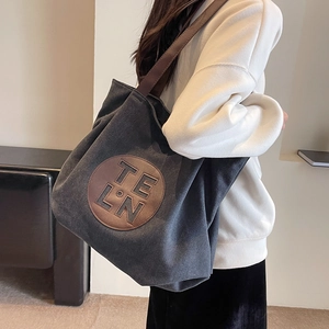 Large capacity canvas tote bag in charcoal grey with leather patch and brown straps