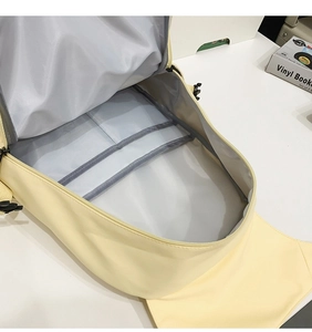Internal view of a canvas backpack showing functional pockets and large main compartment