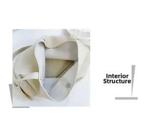 Interior view of off-white lychee leather tote bag showing main pocket and magnetic buckle