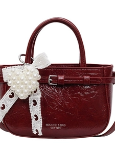 Modische dunkelrote Lackleder-Eimertasche für Damen mit Spitzenschleife und Metallschnalle