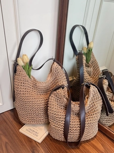 Handwoven straw tote bag with leather straps in two sizes for summer vacations
