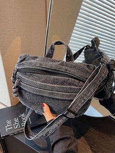 Washed dark grey denim crossbody bag with vintage texture and adjustable wide strap