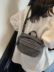 Washed dark gray denim shoulder bag with multi-layer zipper and soft vintage crescent design