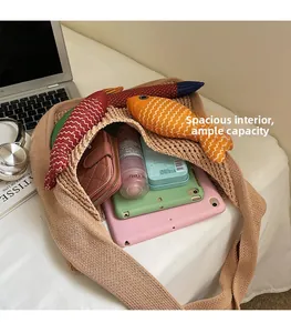Top view of spacious woven tote bag showing internal storage for tablets and cosmetics