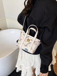 Mini beige graffiti tote bag with colorful prints and shoulder strap for women