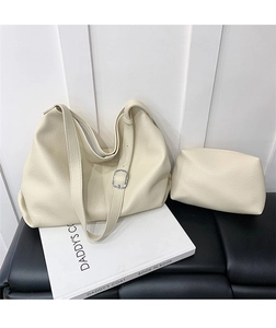 Detail of off-white lychee texture tote bag and pouch set with silver buckle strap