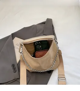 Interior view of beige saddle bag showing large capacity for phone and wallet