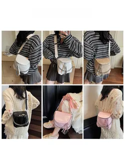 Fashionable saddle bags in four colors with decorative metal chains and long tassel zippers
