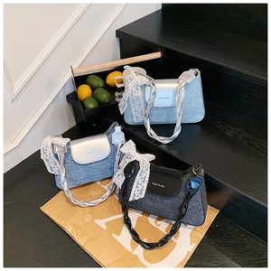 Detailed view of fashion shoulder bags with lace bows and twisted straps in various textures