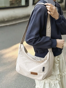Large beige water-resistant nylon messenger bag with CHUANGMI leather label for women