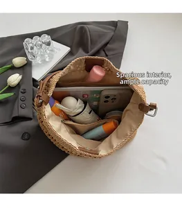 Spacious interior of woven straw tote bag showing large capacity and zipper pocket