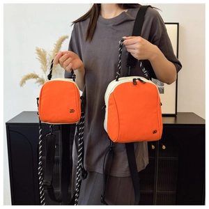 Mini shell-shaped crossbody backpack in orange and cream showing dual size options