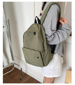 Olive green lightweight nylon backpack with large main compartment and side pockets