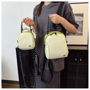 Comparison of large and small nylon crossbody bags with logo detail and woven handles