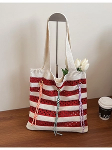 Knitted tote bag with red and white stripes and colorful decorative braided ropes