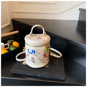 Close-up of a white graffiti bucket bag with colorful prints and round handles