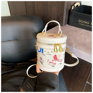 Top view of a white graffiti bucket bag showing gold zippers and WEIWESHUIA branding
