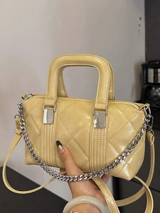 Yellow retro quilted crossbody handbag with silver chain strap and leather handle