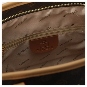 Detail shot of the brown tote bag interior with branded lining and smooth metal zipper