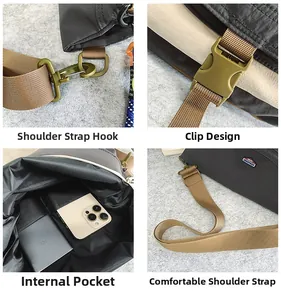 Detail view of large nylon crossbody bag showing durable buckle and inner pockets