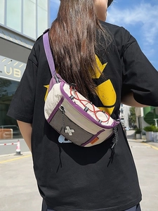 Sporty cream crossbody chest bag with purple straps and orange label on a model