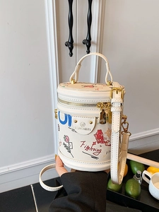 White cylinder bucket bag with colorful graffiti and adjustable strap for women