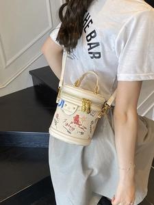 Modern graffiti bucket bag in beige PU leather with artistic fish and star patterns