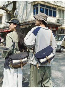 Outdoor crossbody bag featuring contrast color patchwork and adjustable shoulder strap