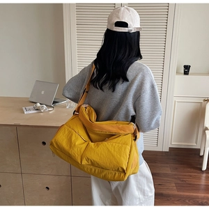 Large yellow casual crossbody tote bag made of lightweight fabric for daily commute use