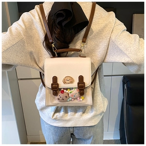 Detail view of mini backpack with vintage double straps and clear display window