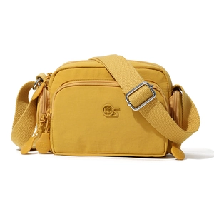 Dettagli della borsa a tracolla in nylon giallo zenzero con tasche e tracolla regolabile