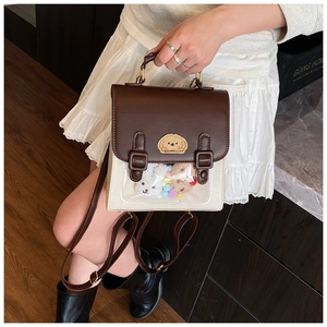 Detailed close-up of a vintage college style ita bag with transparent display window