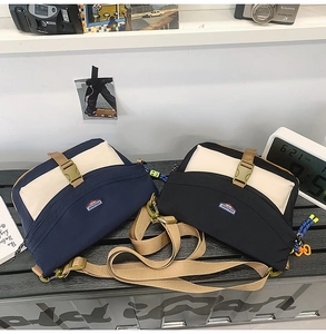 Detail of color-block nylon crossbody bags with adjustable straps in a casual urban setting
