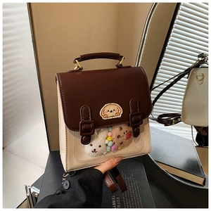 Detail of the dual-tone bag with cute puppy embroidery and transparent interior layer