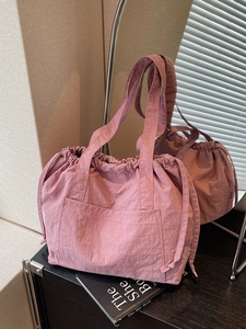 Large capacity nylon drawstring tote bag for women in dusty rose pink color with mirror view