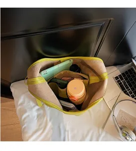 Top view of lime green tote interior showing main compartment and zipper pocket