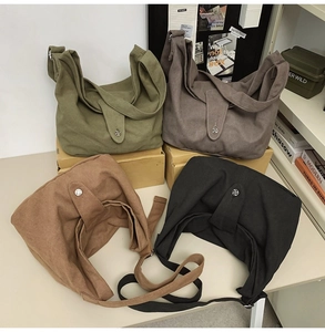 Collection of oversized canvas hobo bags with metallic buckles in four earthy tones