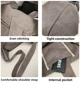 Detail view of reinforced stitching, wide strap, and inner pocket on brown canvas tote bag