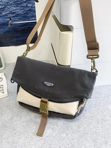 Minimalist nylon crossbody messenger bag in grey and beige with adjustable brown strap