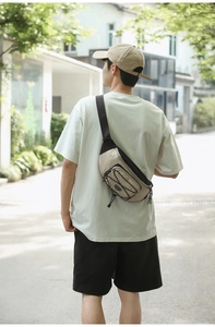 Detail of outdoor crossbody bag with khaki and black nylon and elastic drawstring