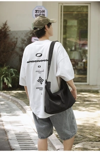 Rear view of white oversized cotton t-shirt with black graphic print and lettering