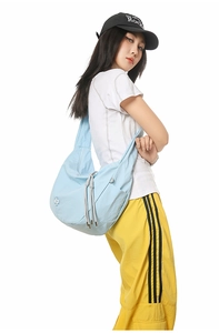 Close-up of light blue checkered dumpling bag with side drawstring and logo detail