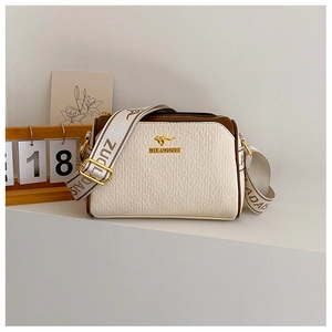 Detail of beige Boston bag with golden kangaroo logo and stylish wide jacquard strap