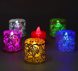 Macro detail of laser-cut leaf pattern on colorful LED tea light decorative sleeves