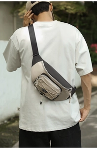 Detail of cross-body chest bag with beige and dark grey nylon fabric and elastic drawstring